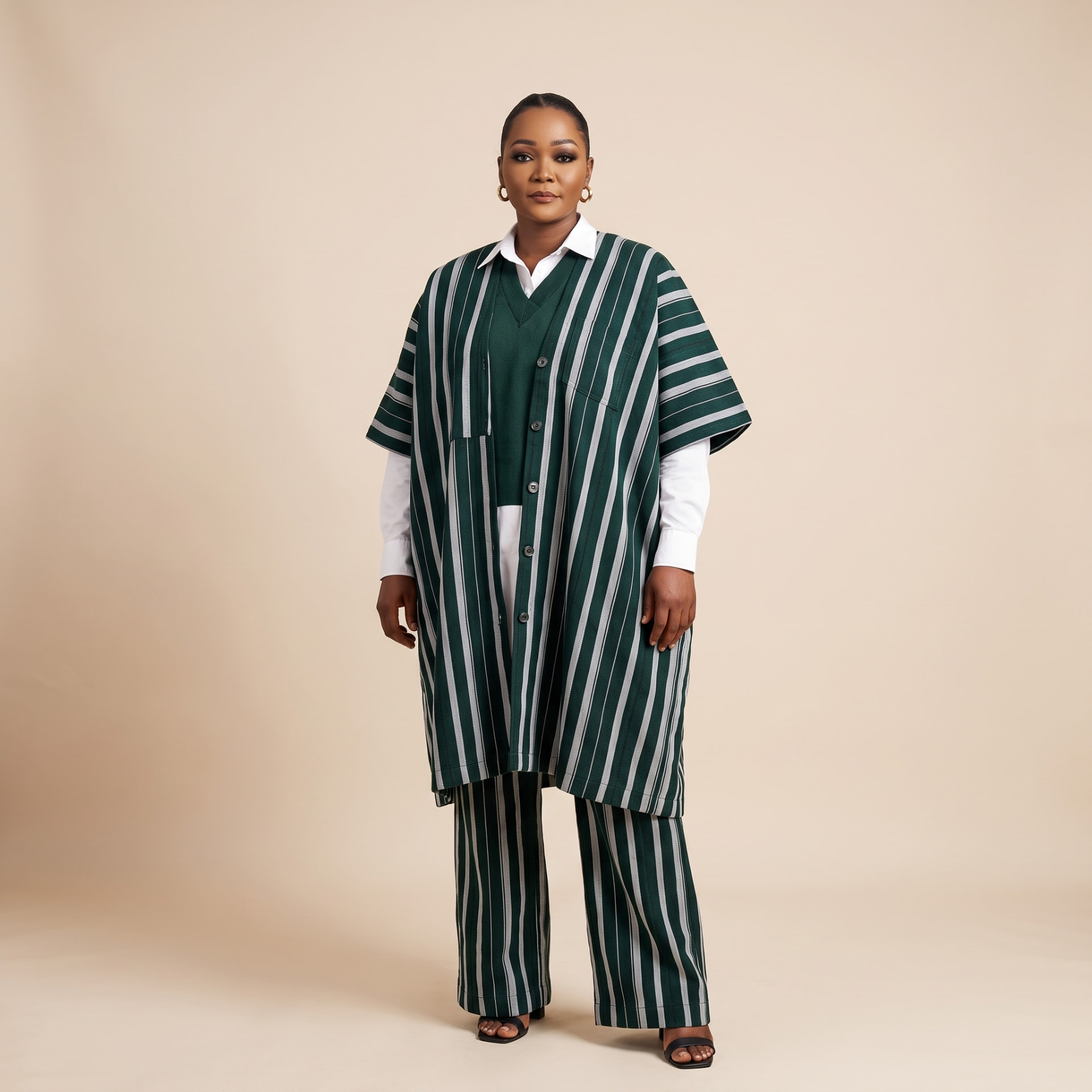 Model wearing The Amina striped aso-oke kimono and trouser set